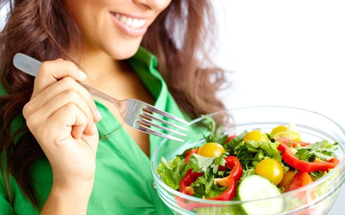 girl eating vegetable salad on a 6 petal diet